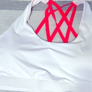 White and neon orange sports bra